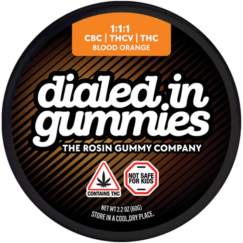 Round black Dialed In Gummies tin with an orange label reading 1:1:1 CBC, THCV, THC, blood orange.