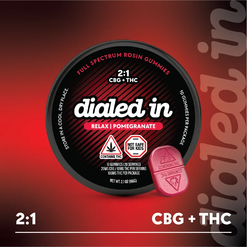 Dialed In Pomegranate 2:1 CBG:THC Rosin Gummies 100mg: a black tin of 10 full-spectrum rosin gummies with one red gummy in front.