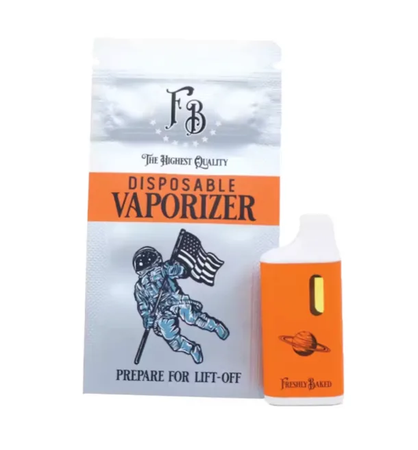 Silver Freshly Baked disposable vaporizer pouch with an astronaut and flag illustration, beside an orange all-in-one vape device.