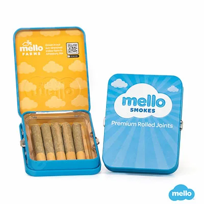 Open blue Mello Smokes tin showing a row of pre-rolls inside, beside the closed tin labeled premium rolled joints.