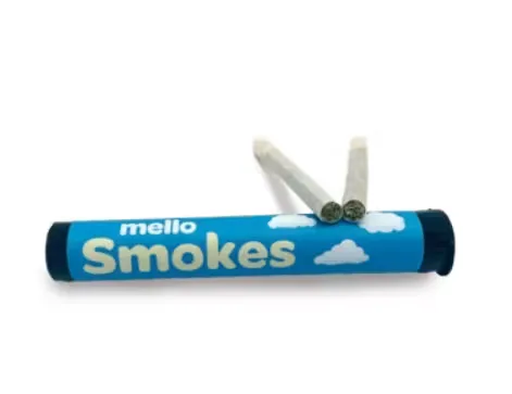 Blue Mello Smokes tube with cloud graphics and two pre-rolls resting on top.