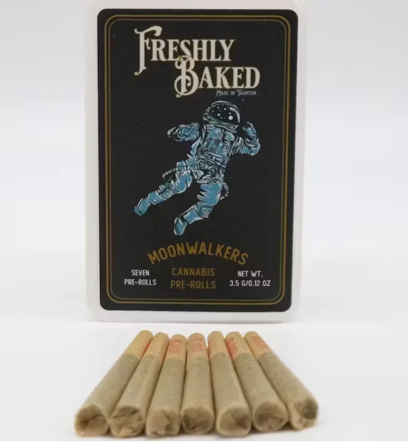 Navy Freshly Baked Moonwalkers box with an astronaut illustration, labeled seven pre-rolls, 3.5g, with seven pre-rolls lined up below.
