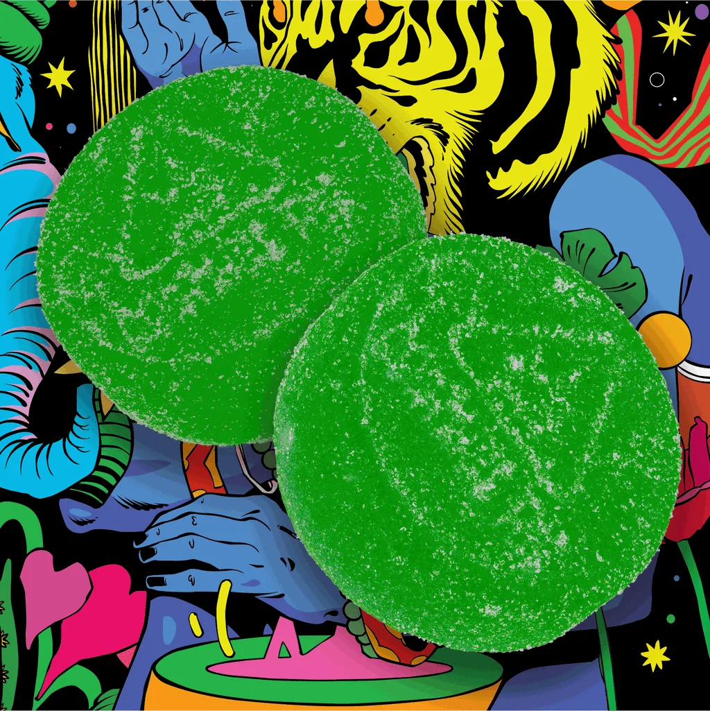 Two green sugar-coated round gummies on a brightly colored illustrated background.