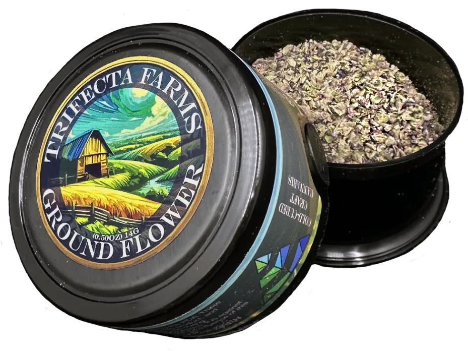 Open black tin of ground cannabis flower beside its lid, printed with a farm and barn scene and the words Trifecta Farms Ground Flower.
